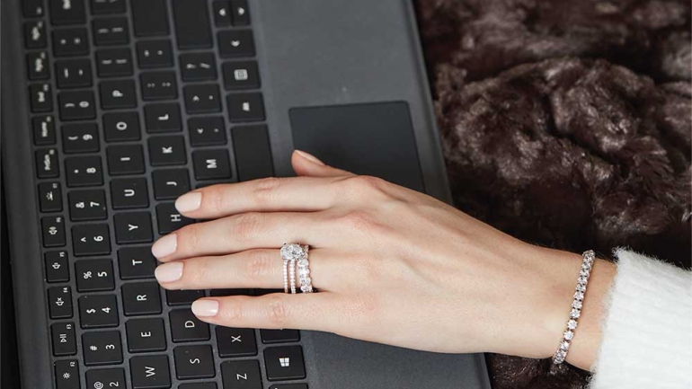 Women Wearing Lab Grown Diamond Rings and Bracelet Typing