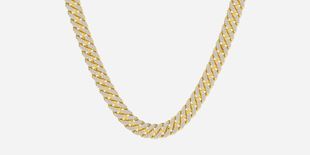 A gold Cuban link chain necklace with diamond pavé setting, featuring thick interlocking links completely covered in sparkling stones, displayed against a white background in an arc shape.